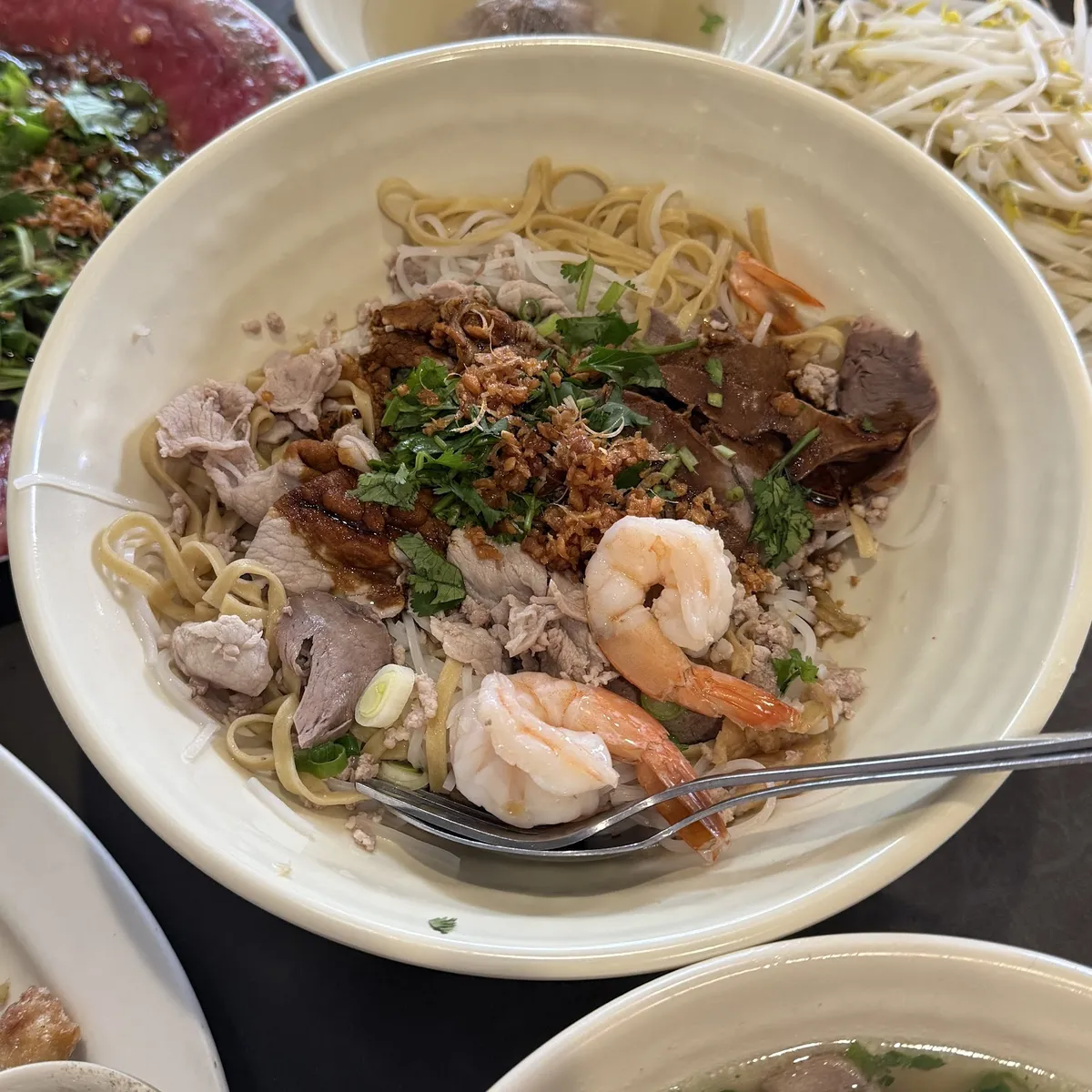 Noodle dish with shrimp, pork, and herbs